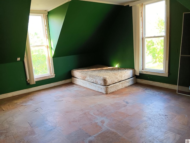 703 Fulton St, Hickman, KY 42050 - unfurnished bedroom featuring multiple windows and baseboards