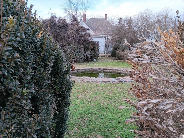 703 Fulton St, Hickman, KY 42050 - view of grassy yard with an attached garage