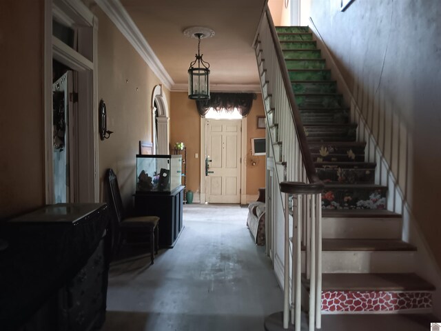 703 Fulton St, Hickman, KY 42050 - stairway featuring crown molding and concrete flooring