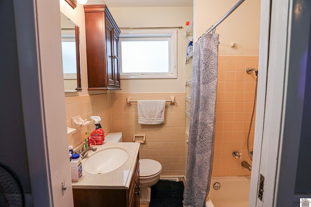 1124 Friedman Ln, Paducah, KY 42001 - full bathroom featuring toilet, tile walls, a wainscoted wall, vanity, and shower / bath combo