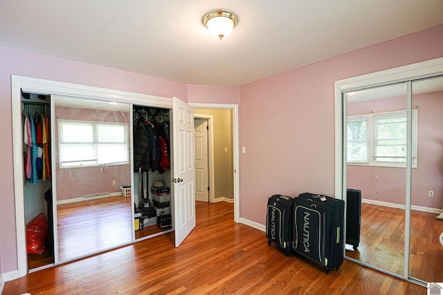 1124 Friedman Ln, Paducah, KY 42001 - unfurnished bedroom featuring wood finished floors and baseboards