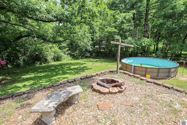 1124 Friedman Ln, Paducah, KY 42001 - view of green lawn with a fire pit and an outdoor pool