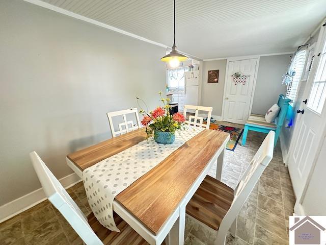 3944 Old Mayfield Rd, Paducah, KY 42003 - dining room featuring baseboards and crown molding