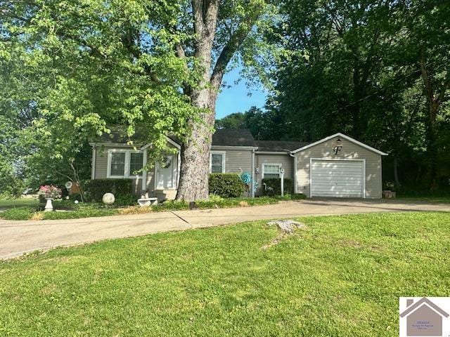 3944 Old Mayfield Rd, Paducah, KY 42003 - view of front facade featuring driveway, an attached garage, and a front yard