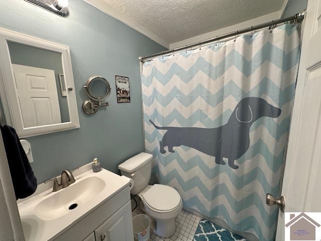 3944 Old Mayfield Rd, Paducah, KY 42003 - full bathroom with a textured ceiling, toilet, vanity, tile patterned floors, and a shower with shower curtain
