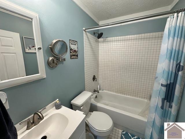 3944 Old Mayfield Rd, Paducah, KY 42003 - full bath with shower / bath combo, toilet, a textured ceiling, vanity, and tile patterned floors