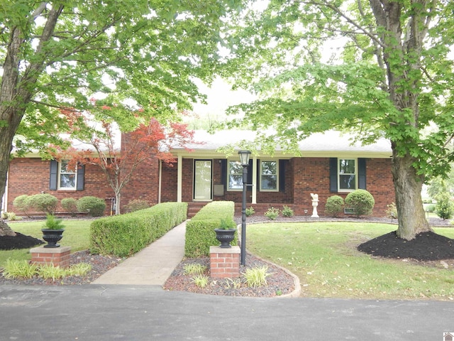 60 Cole Ln, Benton, KY 42025 - ranch-style house featuring a front lawn and brick siding