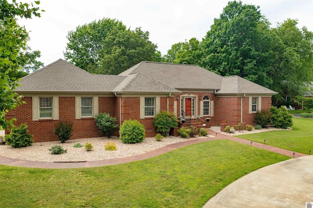 91 Robertson Rd S, Murray, KY 42071 - view of front facade with a shingled roof, brick siding, and a front lawn
