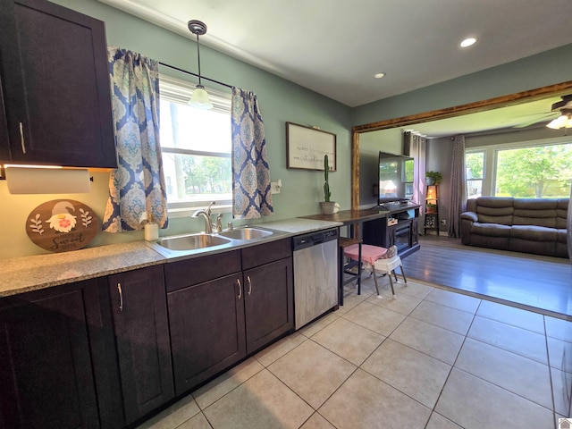 2230 Seneca Ln, Paducah, KY 42001 - kitchen featuring stainless steel dishwasher, plenty of natural light, light tile patterned flooring, a sink, and recessed lighting