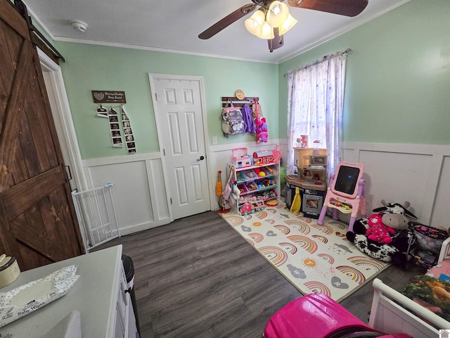2230 Seneca Ln, Paducah, KY 42001 - game room with crown molding, wainscoting, ceiling fan, wood finished floors, and a barn door