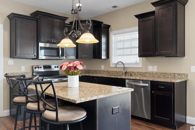 115 Pinewood Trl, West Paducah, KY 42086 - kitchen with appliances with stainless steel finishes, a sink, and dark wood-type flooring
