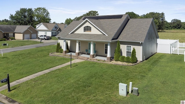 115 Pinewood Trl, West Paducah, KY 42086 - view of front facade with a porch, a shingled roof, a garage, and a residential view