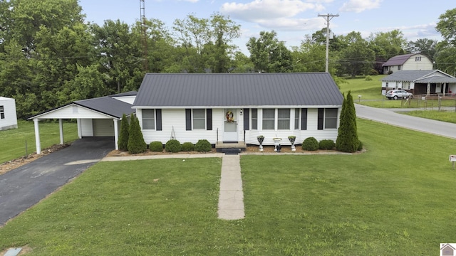 103 Leland Ave, Marion, KY 42064 - ranch-style house with asphalt driveway, a front yard, and metal roof