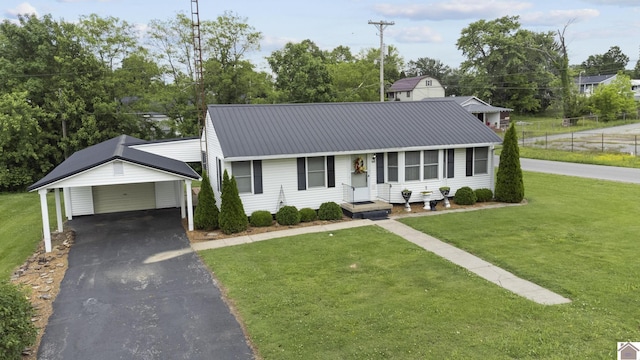 103 Leland Ave, Marion, KY 42064 - view of front of property featuring asphalt driveway, metal roof, and an outbuilding