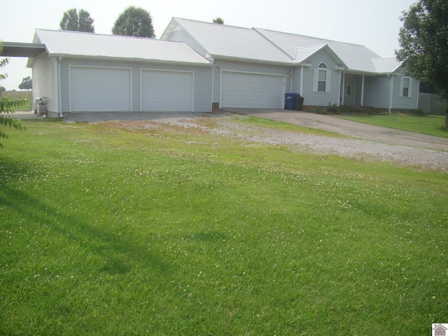115 Meadowbrook Dr, Cadiz, KY 42211 - single story home with driveway, an attached garage, a metal roof, and a front lawn