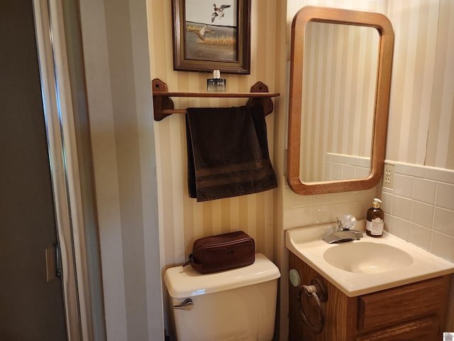 359 Lap Rollings Rd, Barlow, KY 42024 - half bathroom featuring wallpapered walls, vanity, and toilet