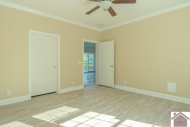 631 Imogene Dr, Gilbertsville, KY 42044 - unfurnished room featuring crown molding, light wood finished floors, a ceiling fan, and baseboards