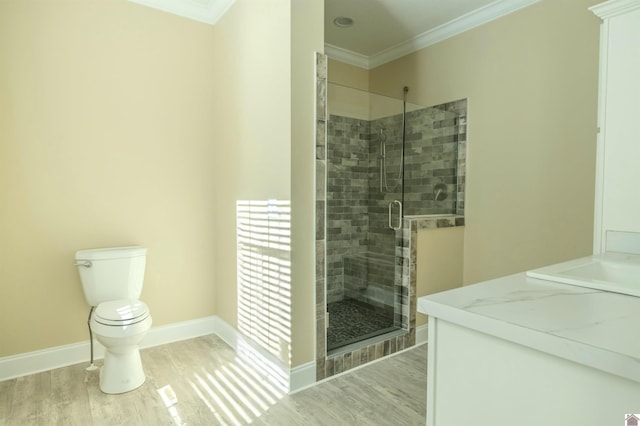 631 Imogene Dr, Gilbertsville, KY 42044 - full bath featuring crown molding, wood finished floors, a shower stall, toilet, and baseboards