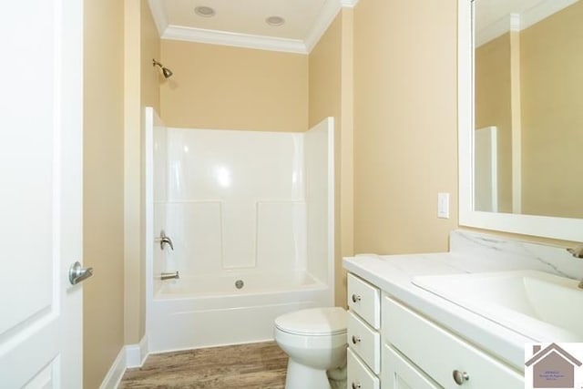 631 Imogene Dr, Gilbertsville, KY 42044 - full bath featuring crown molding, toilet, vanity, wood finished floors, and tub / shower combination