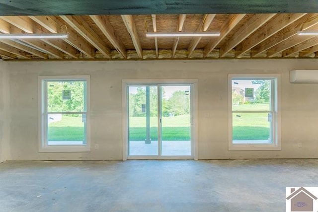 631 Imogene Dr, Gilbertsville, KY 42044 - entryway with an AC wall unit, unfinished concrete floors, and plenty of natural light