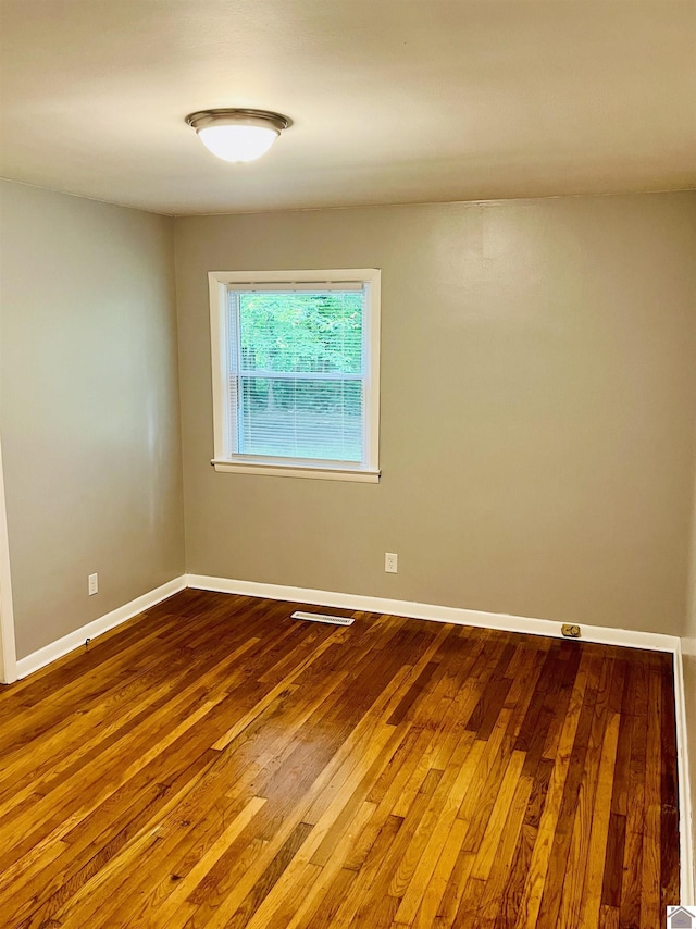 908 N 21st St, Paducah, KY 42001 - empty room with hardwood / wood-style flooring and baseboards