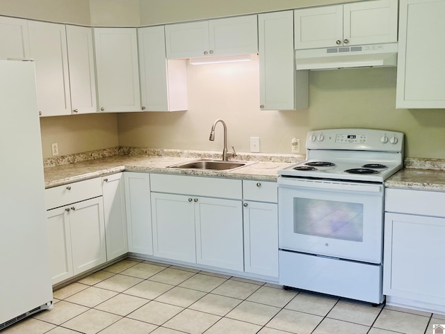 908 N 21st St, Paducah, KY 42001 - kitchen featuring under cabinet range hood, white appliances, a sink, light countertops, and white cabinetry