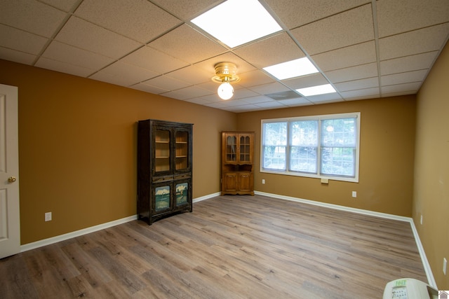 1055 Lakeview Dr, Paducah, KY 42003 - unfurnished room with a paneled ceiling, wood finished floors, and baseboards