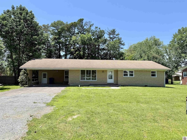 701 N 18th St, Murray, KY 42071 - ranch-style house featuring gravel driveway, a front yard, and a carport