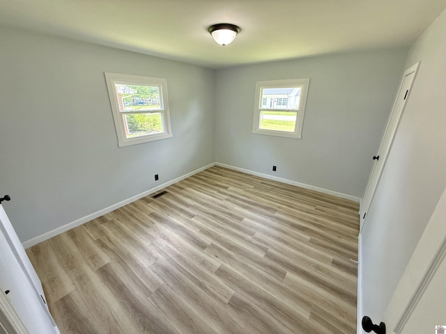 701 N 18th St, Murray, KY 42071 - spare room featuring plenty of natural light, baseboards, and light wood-style flooring