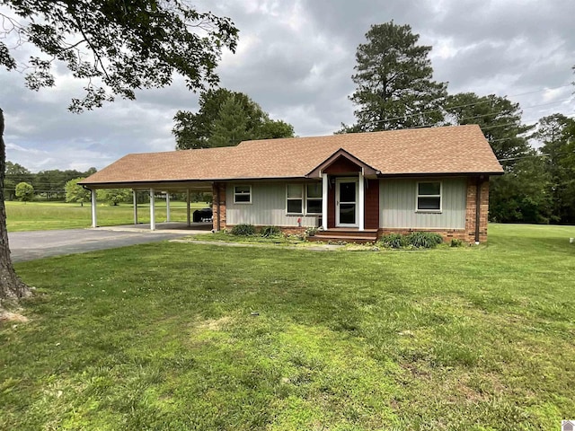 10187 E U S Highway 68, Benton, KY 42025 - ranch-style house featuring asphalt driveway, a carport, a front yard, and a shingled roof