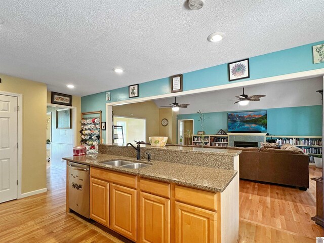 189 Edinborough W, Murray, KY 42071 - kitchen with dishwasher, a sink, a textured ceiling, light wood-style flooring, and a ceiling fan