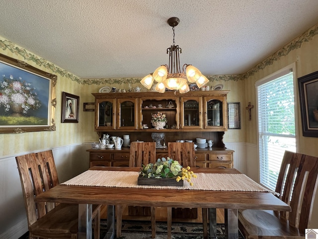 189 Edinborough W, Murray, KY 42071 - dining room with a wainscoted wall, wallpapered walls, a textured ceiling, and a chandelier