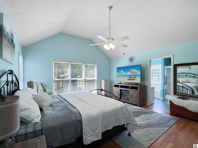 189 Edinborough W, Murray, KY 42071 - bedroom with lofted ceiling, wood finished floors, a textured ceiling, a ceiling fan, and ensuite bathroom