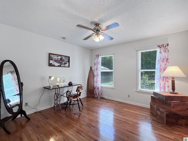 189 Edinborough W, Murray, KY 42071 - dining room with wood-type flooring, ceiling fan, a textured ceiling, and baseboards