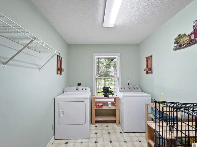189 Edinborough W, Murray, KY 42071 - laundry room featuring separate washer and dryer, a textured ceiling, and light flooring