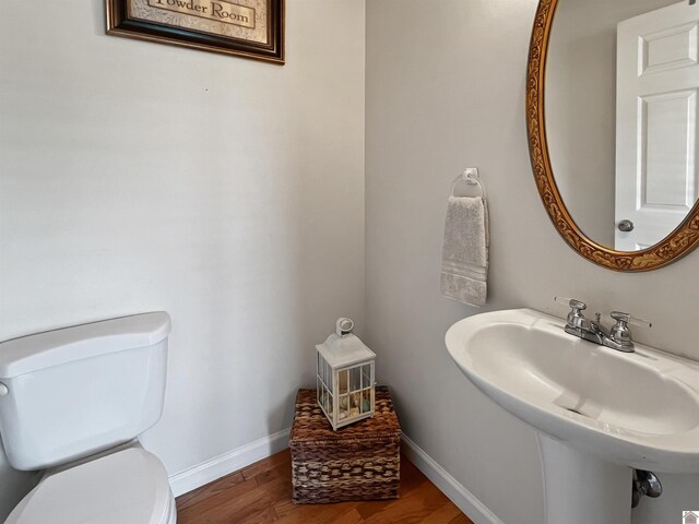 189 Edinborough W, Murray, KY 42071 - bathroom featuring toilet, wood finished floors, a sink, and baseboards