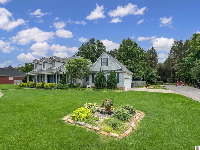 189 Edinborough W, Murray, KY 42071 - view of front facade featuring driveway and a front yard