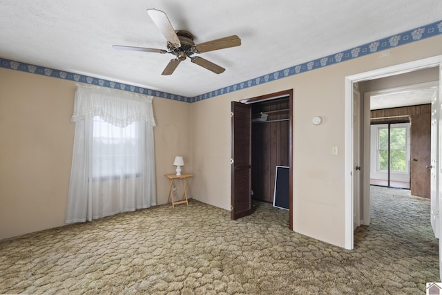 1158 State Route 295, Marion, KY 42064 - unfurnished bedroom featuring carpet flooring, a closet, and a ceiling fan