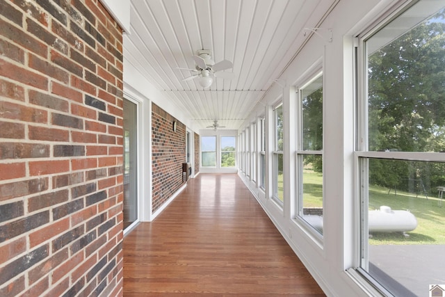 1158 State Route 295, Marion, KY 42064 - unfurnished sunroom with brick wall and wood finished floors