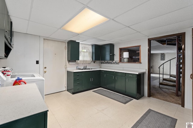 1158 State Route 295, Marion, KY 42064 - kitchen featuring green cabinetry, a paneled ceiling, light countertops, washer / clothes dryer, and light floors