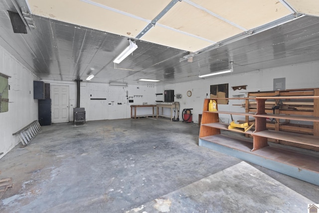 1158 State Route 295, Marion, KY 42064 - garage with a workshop area and a wood stove
