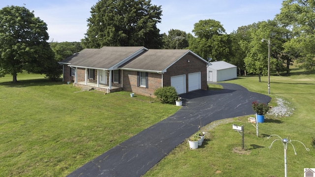 1158 State Route 295, Marion, KY 42064 - ranch-style home with covered porch, brick siding, and a front lawn