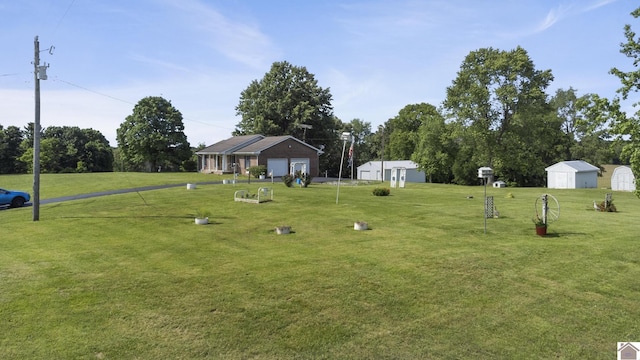 1158 State Route 295, Marion, KY 42064 - view of green lawn featuring a detached garage