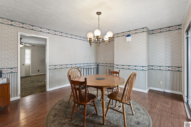 1158 State Route 295, Marion, KY 42064 - dining room with wood-type flooring, a chandelier, wallpapered walls, and a wainscoted wall