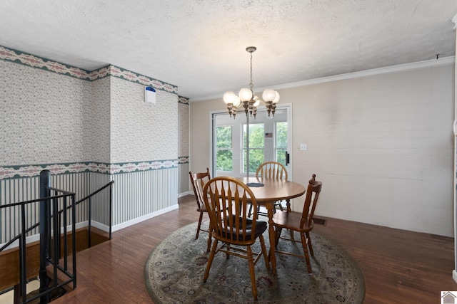 1158 State Route 295, Marion, KY 42064 - dining room with wood finished floors, a chandelier, a textured ceiling, and crown molding