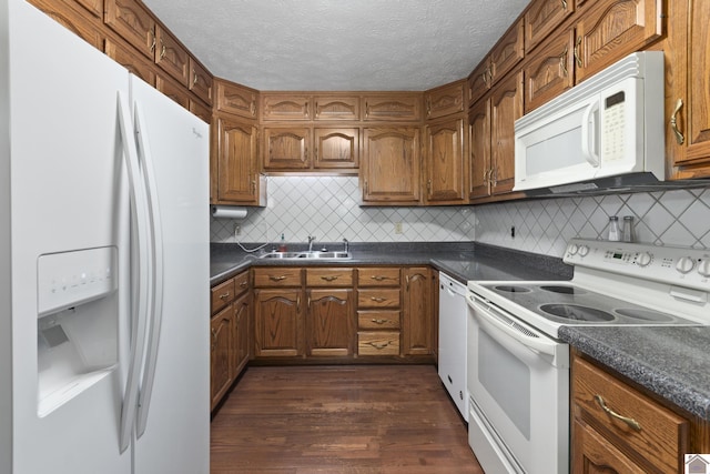 1158 State Route 295, Marion, KY 42064 - kitchen with white appliances, a sink, dark countertops, dark wood finished floors, and a textured ceiling