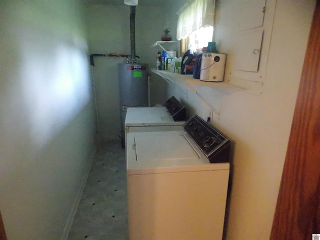 528 Elm, Clinton, KY 42031 - laundry area featuring washing machine and clothes dryer, water heater, and baseboards