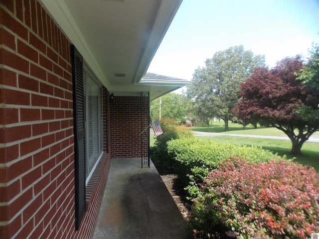 528 Elm, Clinton, KY 42031 - view of side of home with brick siding and a porch