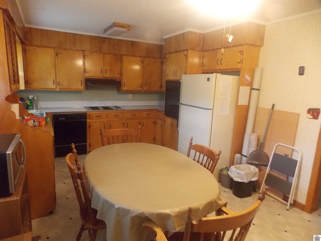 528 Elm, Clinton, KY 42031 - kitchen with black appliances, ornamental molding, under cabinet range hood, and brown cabinetry