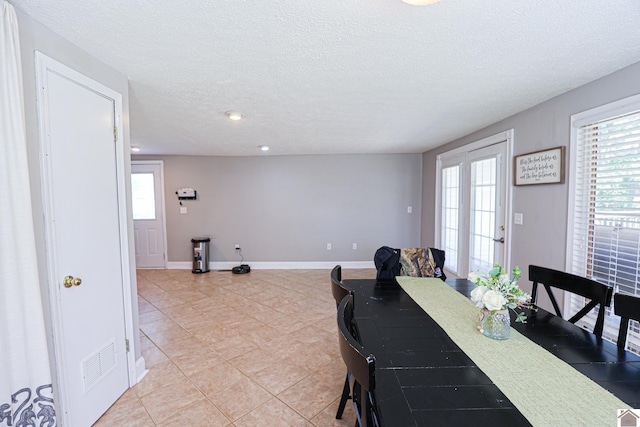 157 Calvert Dr, Paducah, KY 42003 - dining room with a textured ceiling, light tile patterned floors, baseboards, and recessed lighting